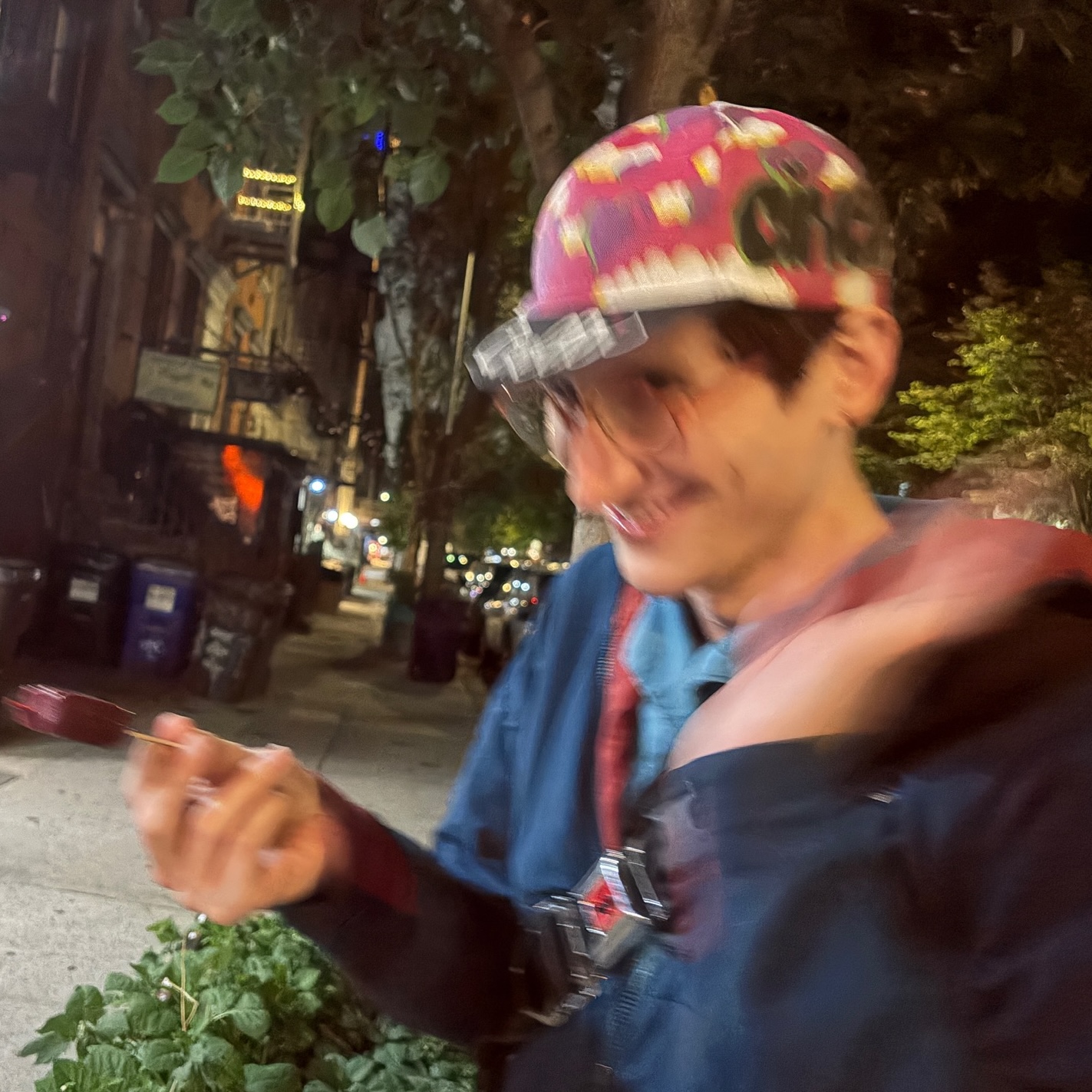 a blurry picture of xena in a cycling cap and light jacket, reveling on the sidewalks of New York City